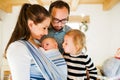 Young parents with two children at Christmas time. Royalty Free Stock Photo