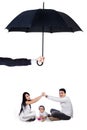 Young parents playing with their daughter under umbrella Royalty Free Stock Photo