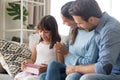 Parents congratulate cute daughter making birthday present