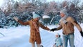 Young parents sledding his child