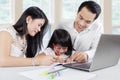 Young parents teach their child at home Royalty Free Stock Photo