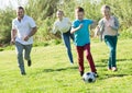 Young parents with two children playing soccer Royalty Free Stock Photo