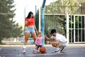 Young parents walk with their daughter on the playground Royalty Free Stock Photo