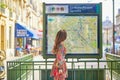 Young Parisian woman near the subway plan Royalty Free Stock Photo