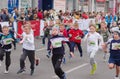 Young participants hurrying to finish line during kids section of `Dnepr Eco Marathon` race