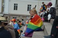 Helsinki Pride 2019 - young participants with rainbow flags on Cathedral steps