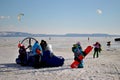 Young participants of the SnowKite Would Cup are standing near a special hovercraft.