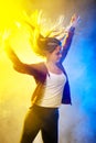 Party girl dancing against fog background Royalty Free Stock Photo