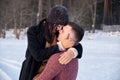 Young passionate couple hugging on a winter day on the park Royalty Free Stock Photo