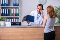 Young patient at the reception in the hospital Royalty Free Stock Photo