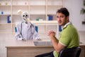 Young male patient visiting skeleton doctor Royalty Free Stock Photo