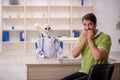 Young male patient visiting skeleton doctor Royalty Free Stock Photo