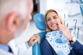 A young patient visits the dentist because she has tooth pain Royalty Free Stock Photo