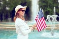 Young patriot woman at 4th of July in park