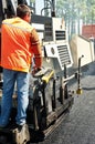 Young paver worker at asphalting Royalty Free Stock Photo