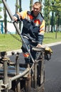 Young paver worker at asphalting Royalty Free Stock Photo