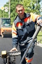 Young paver worker at asphalting Royalty Free Stock Photo