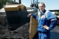 Young paver worker at asphalting