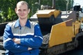 Young paver worker at asphalting