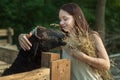 Young peasant woman is engaged in farming on the ranch