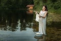 Woman washing clothes in the river