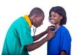 Young pediatrician doctor examining nurse with stethoscope Royalty Free Stock Photo