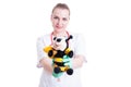 Young pediatrician holding a fuzzy plush toy and smile