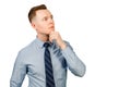 Young pensive businessman dressed in blue shirt and tie think, isolated on white background