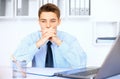 Young pensive businessman in office Royalty Free Stock Photo