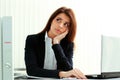 Young pensive businesswoman looking away at copyspace Royalty Free Stock Photo