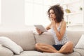 Young pensive girl with digital tablet at home Royalty Free Stock Photo