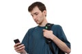 A young pensive man with smartphone