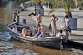 Young people on a boat in Amsterdam Royalty Free Stock Photo