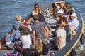 Young people on a boat cruising through the Canals of Amsterdam Royalty Free Stock Photo