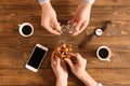 Young people with brain teasers at wooden table