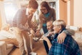 Young people came to visit the older man and woman in a nursing home. Royalty Free Stock Photo