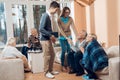 Young people came to visit the older man and woman in a nursing home. Royalty Free Stock Photo