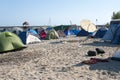 Young people camped on the beach.