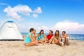 Young people camping on beach