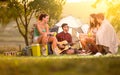 Young people on camping trip spending time together Royalty Free Stock Photo