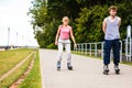 Young people casually rollblading together.