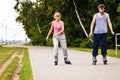 Young people casually rollblading together.