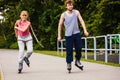 Young people casually rollblading together.