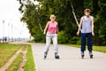 Young people casually rollblading together.