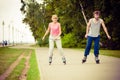 Young people casually rollblading together.