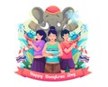 Young people celebrate Songkran Festival by playing water with the mascot elephant. Thailand Traditional New Year`s Day Royalty Free Stock Photo