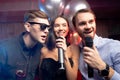 Young people celebrating birthday in karaoke bar Royalty Free Stock Photo