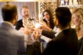 Young people celebrating and toasting with white wine Royalty Free Stock Photo