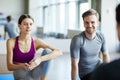 Young people chatting before yoga class