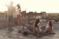 Friends hanging out on a building rooftop